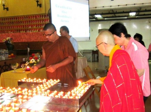 Reverends from Mahayana and Theravada Tradition lighting the candles